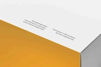 Verpackung mit Aufdruck zu Hersteller-Garantie und deutscher Ingenieurskunst, inklusive Weblink für Garantieinformationen.